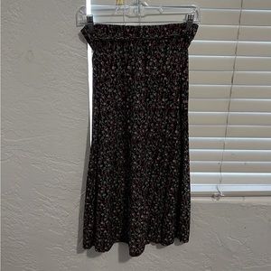 Calf length skirt with little flowers on it and a belt around the waist